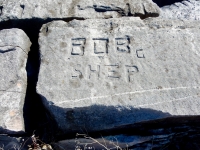 Bob, C, Shep. Chicago lakefront stone carvings, Rainbow Beach. 2019