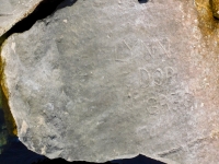 Lynn Dor Greg, detail. Chicago lakefront stone carvings, Rainbow Beach jetty. 2022