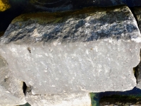 PE, RS, Susey(?). Chicago lakefront stone carvings, Rainbow Beach jetty. 2022