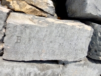 Boots, Fitzy. Chicago lakefront stone carvings, Rainbow Beach North. 2019