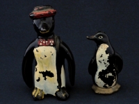 Penguins were an ever popular shape for S&Ps and toothpick holders. These two traveled some rough roads to finally come together. Penguins were an ever popular shape for S&Ps and toothpick holders. These two traveled some rough roads to finally come together.