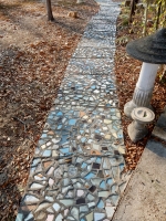 Sidewalk with embedded ceramics, Howard Finster's Paradise Garden, 2016