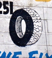Rudy's Tire Shop sign, tire detail Rudy's Tire Shop sign, tire detail