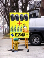 Tires + Oil bottles sign. Tires + Oil bottles sign.