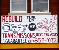 Cabrales Auto Repair, sign with transmission and scorpion Cabrales Auto Repair, sign with transmission and scorpion