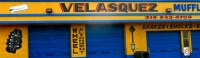 Velasquez Muffler with sign and auto parts painted the wall Velasquez Muffler with sign and auto parts painted the wall