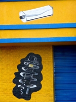 Velasquez Muffler with sign and auto parts painted the wall Velasquez Muffler with sign and auto parts painted the wall