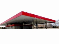 Dead gas station from corner of overhang