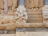 Not sure if the saint is picking his nose, but it would certainly show appropriate contempt for the threat of the lions. St. Trophime, Arles