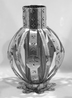 Stanley Szwarc stainless steel vase with perforated interior and narrow cylinder on top
