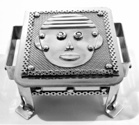 Stanley Szwarc stainless steel face box with horizontal hair style, front view