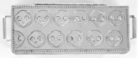 Stanley Szwarc stainless steel face box with 12 alien-like faces