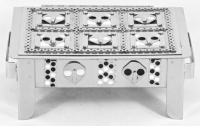 Stanley Szwarc stainless steel face box  with six alien-like faces on white and black backgrounds, front view