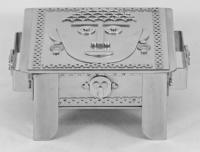 Stanley Szwarc stainless steel face box with hair and earrings, front view
