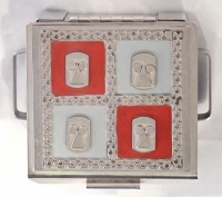 Stanley Szwarc stainless steel face box with four faces on red and blue backgrounds