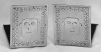 Stanley Szwarc stainless steel bookends with faces