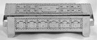 Stanley Szwarc stainless steel wide face box with nine faces, front view