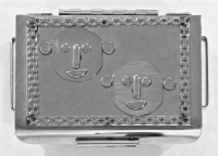 Stanley Szwarc stainless steel face box two cartoonish faces