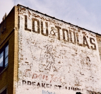 Lou & Toula's ghost sign on Peterson Avenue, now gone Lou & Toula's ghost sign on Peterson Avenue, now gone