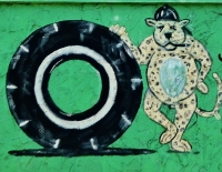 Tire and tiger with a cigar, Ronnie Standridge, now Bargain Tires, U.S. 17, Jacksonville, Florida-Roadside Art Tire and tiger with a cigar, Ronnie Standridge, now Bargain Tires, U.S. 17, Jacksonville, Florida-Roadside Art