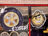 Tire and happy sun window paintings. City Tire, Lincoln near Carmen, Chicago-Roadside Art Tire and happy sun window paintings. City Tire, Lincoln near Carmen, Chicago-Roadside Art