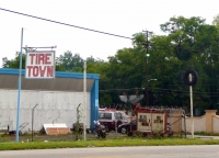 Tire sign and tire on a pole  at Tire Town, Birmingham, Alabama.-Roadside Art