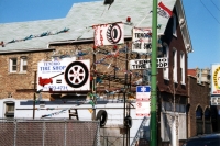 Multiple signs for Tenorio Tire Shop, Western Avenue at 35th Street, Chicago-Roadside Art