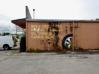 Half a painted tire on wall, Llantera Latino Americana, Nolansville Pike, Nashville-Roadside Art Half a painted tire on wall, Llantera Latino Americana, Nolansville Pike, Nashville-Roadside Art