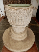 850-year-old font in St. John the Baptist Church, Bere Regis, England