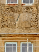 Sundial on old building in Lyme Regis