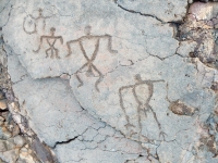 Three male triangle figures from the Waikoloa petroglyphs in Hawaii