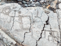 Two stick figures from the Waikoloa petroglyphs in Hawaii