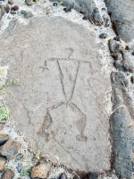 Triangle figure with muscled legs from the Waikoloa petroglyphs in Hawaii Triangle figure with muscled legs from the Waikoloa petroglyphs in Hawaii
