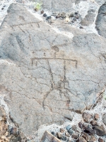 A triangle figure and partial figure from the Waikoloa petroglyphs in Hawaii