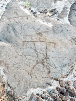 A triangle figure and partial figure from the Waikoloa petroglyphs in Hawaii A triangle figure and partial figure from the Waikoloa petroglyphs in Hawaii