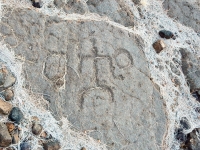 Stick figure between two circles  from the Waikoloa petroglyphs in Hawaii