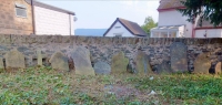 One way to handle old tombstones. St John's Church, Abbey Road, Llangollen, Wales