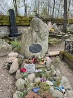 A simpler grave marked with cemetery good taste