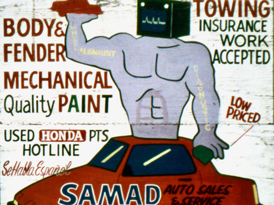 Painted sign for Samad Auto Sales & Service, Chicago, with hybrid person/auto parts figure