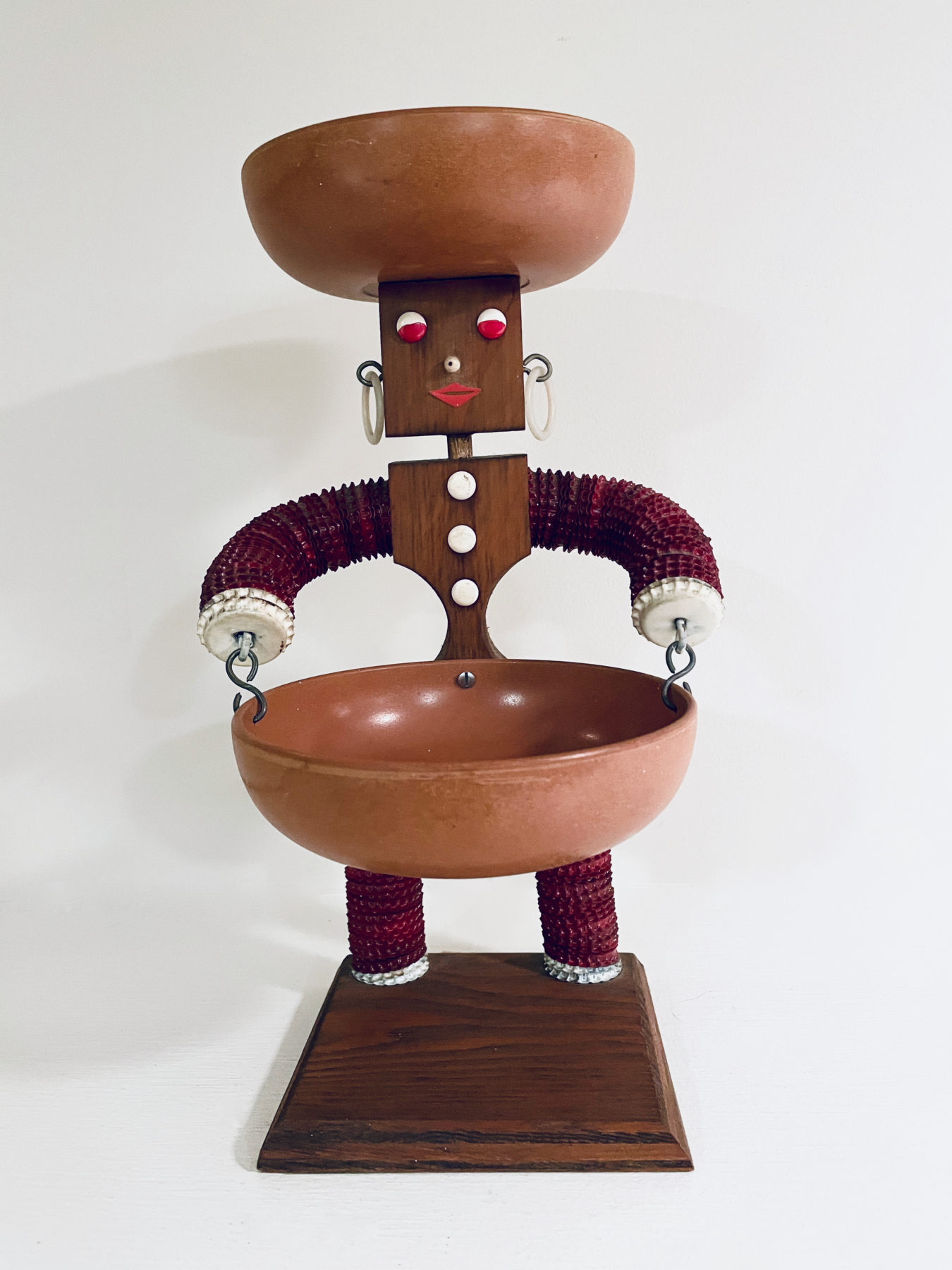 A patent on figures of this design was issued in 1970 to George Kasperan Jr. of Connecticut. This figure bears a  label with patent number D217,277, as do many similar figures